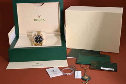 Rolex Day Date 40 Gelbgold 228238 - Full Set - Black Baguette Dial - Like NEW 2023