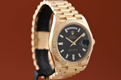 Rolex Day Date 40 Gelbgold 228238 - Full Set - Black Baguette Dial - Like NEW 2023